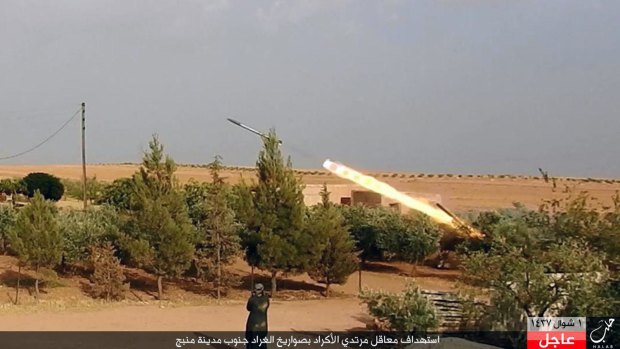 A member of Islamic State militants fires a Grad missile towards Kurdish-led forces in Manbij.