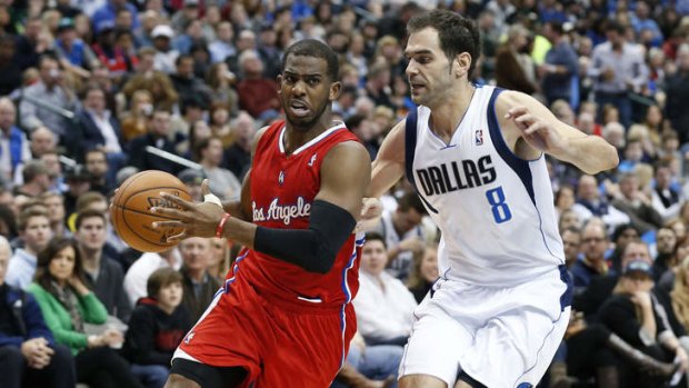 Los Angeles Clippers guard Chris Paul controls the ball as Dallas Mavericks guard Jose Calderon defends during the first half on Friday in Dallas.