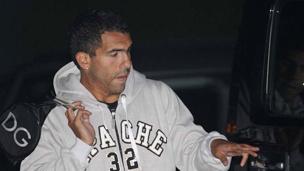 Carlos Tevez leaves Manchester City's Carrington ground training complex after a training session last week.