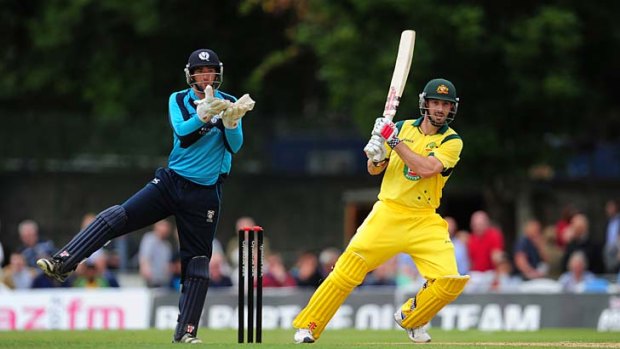 Shaun Marsh pulls a ball to the boundary as Scotland wicketkeeper David Murphy looks on during the one-day tie between Scotland and Australia at the Grange on Tuesday.