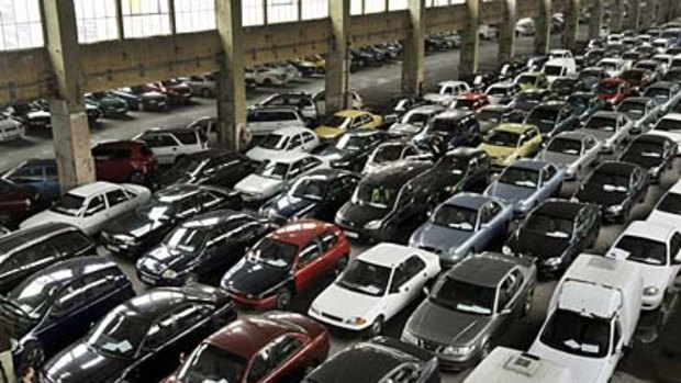 Take your pick . . . repossessed cars await auction in a hangar in Budapest. Hungary has been among the worst-hit countries in the global financial crisis and tens of thousands of leased cars have been repossessed by banks and leasing companies.