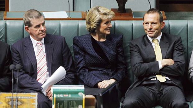 Victory ... Peter Slipper,  Julie Bishop and Tony Abbott  yesterday.