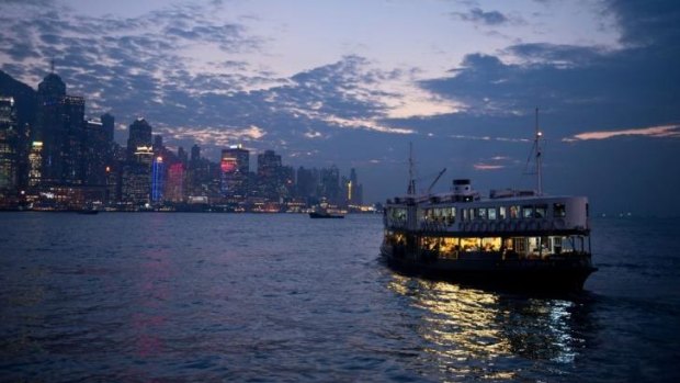 Commuters travel on the Star Ferry in Victoria Harbour, Hong Kong.