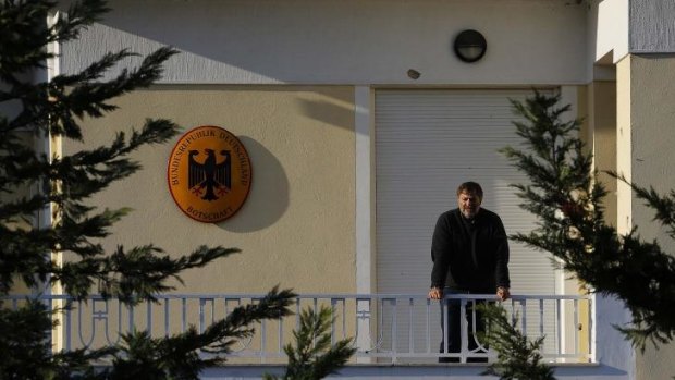 The German Ambassador to Greece, Wolfgang Dold, on the balcony of his residence, which was attacked by unknown gunmen on Monday.
