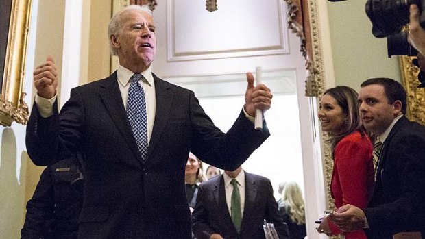 Thumbs up ... US Vice President Joe Biden leaving a closed-door meeting with Senate Democrats.