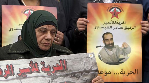 Samer al-Issawi's mother attends a solidarity sit-in outside the Red Cross offices in Jerusalem.