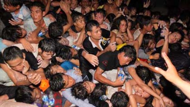 A crowd of Cambodians is pushed onto a bridge on the last day of celebrations of a water festival in Phnom Penh.