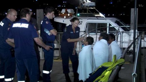 Three people were rescued and a fourth man died of Cardiac arrest near Shark Island.