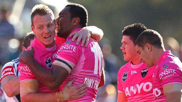 Luke Lewis congratulates Petero Civoniceva after the big forward dives over for a try.