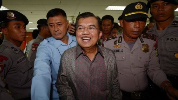 Back to the future: Former Indonesian vice-president Jusuf Kalla (centre) has been given the chance to win back his old job as part of Joko Widodo's election ticket.