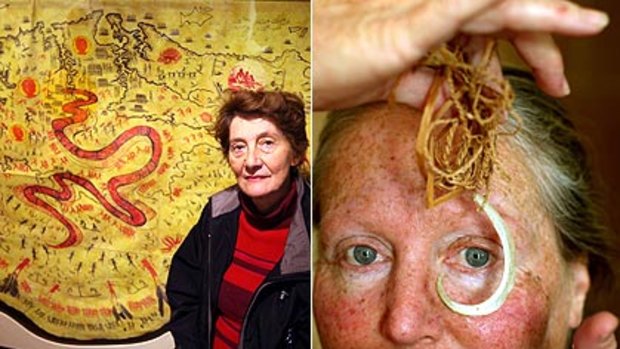 Left: Brenda Saunders with the Pemulwuy cloak and right, Julie Freeman holding traditional fish hook and line at the exhibition.