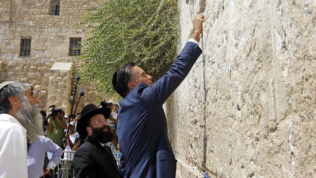 Looking for a blessing ... Mitt Romney used his trip to Jerusalem to pledge America's unwavering support for Israel should he be elected president.