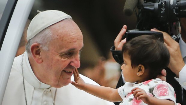 Pope Francis and an admirer in Philadelphia on Sunday. 