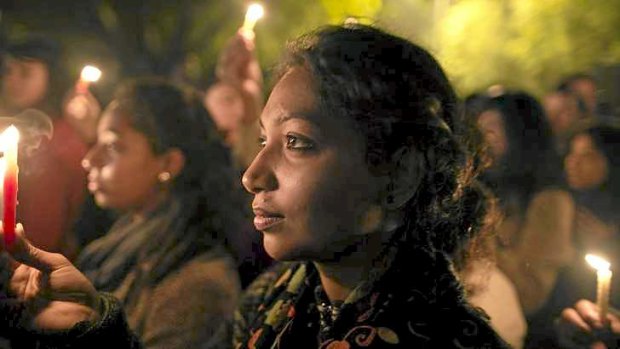 Demonstrators at a candlelight vigil for a gang rape victim who was assaulted in New Delhi on December 29, last year.