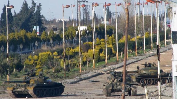 Syrian tanks patrol in Baba Amr near Homs.