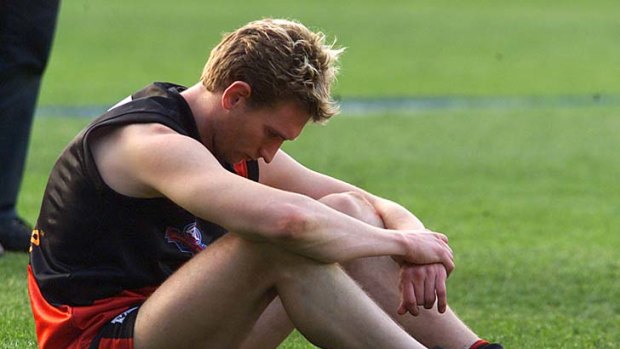 Essendon's James Hird is dejected after the 2001 grand final.