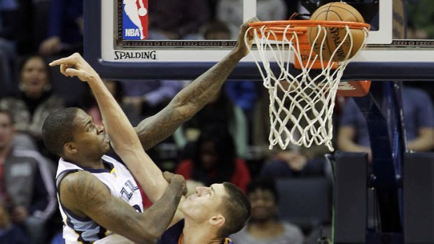 Memphis Grizzlies forward Ed Davis dunks the ball over Phoenix Suns centre Alex Len.