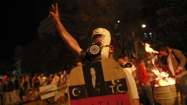 Defiant: An anti-government protester at a demonstration in central Ankara on Sunday.