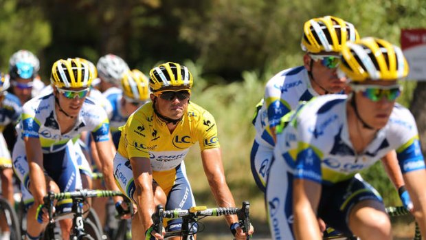 Phenomenal: Simon Gerrans in the leader's yellow jersey rides with the Orica-GreenEDGE team in Aix-en-Provence.