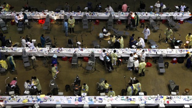 People receive free dental treatment at The Forum in Inglewood, California.
