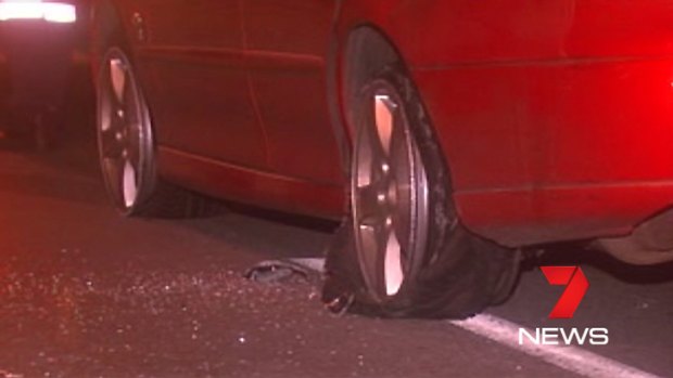 A destroyed tyre on the car involved in the police chase in Brisbane last night.