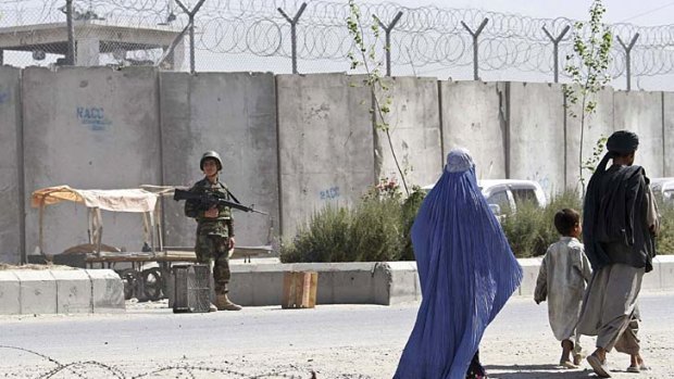 Watch...  an Afghan soldier on guard at the jail.