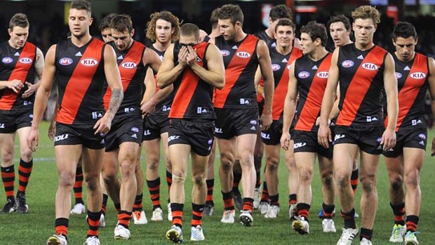 The future ain't bright: Essendon players return to the rooms at half-time during the match against North Melbourne on Saturday.