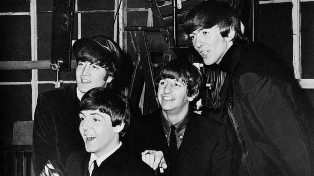 Fresh faced: The Beatles smile for the cameras during an interview for <i>A Hard Day's Night</i>.