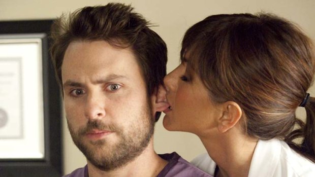 Jennifer Aniston and Charlie Day in Horrible Bosses.