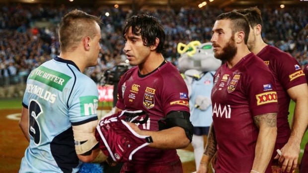 Josh Reynolds and Johnathan Thurston shake hands after their spiteful Origin clash.