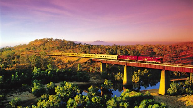 Love a sunburnt country ... The Ghan rolls through the outback.