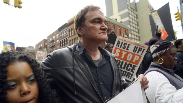 Director Quentin Tarantino, participates in a rally to protest against police brutality in New York. Calls by police groups to boycott his films are putting pressure on one of December's biggest releases.