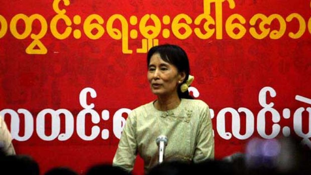 Aung San Suu Kyi addresses supporters at the National League for Democracy headquarters in Rangoon.