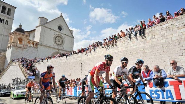 Hilltop end &#8230; riders make their way across the square of the Basilica of St Francis of Assisi on stage 10 of the Giro d'Italia to Assisi.
