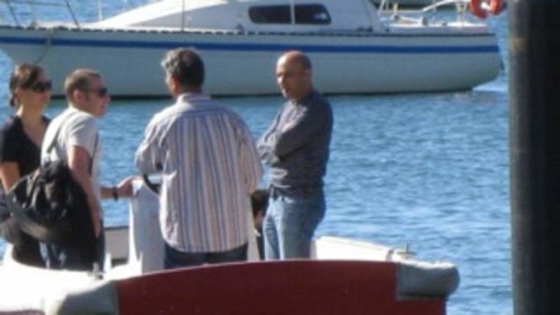 Moses Obeid, far right, and Michael Dalah, second right in striped shirt, at Elizabeth Bay marina in May 2011.