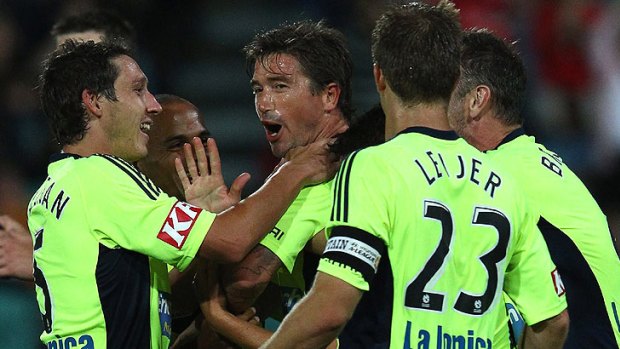 No choke: Kewell celebrates a goal with teammates in a lighter moment.