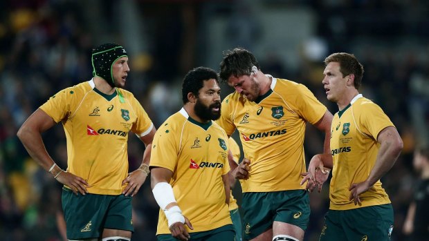 Flogged: Wallabies players look on during the Bledisloe Cup loss to the All Blacks at Westpac Stadium on August 27.