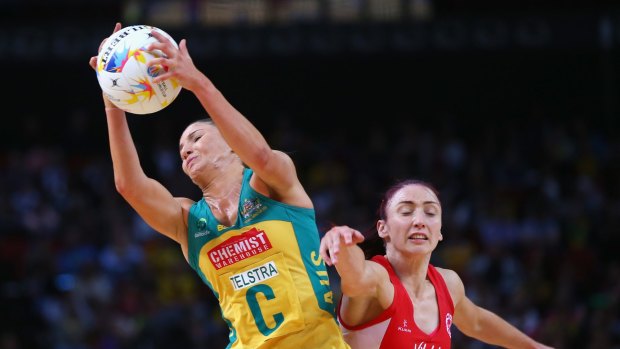 Kimberley Ravaillion of Australia catches the ball under pressure from Jade Clarke of England.