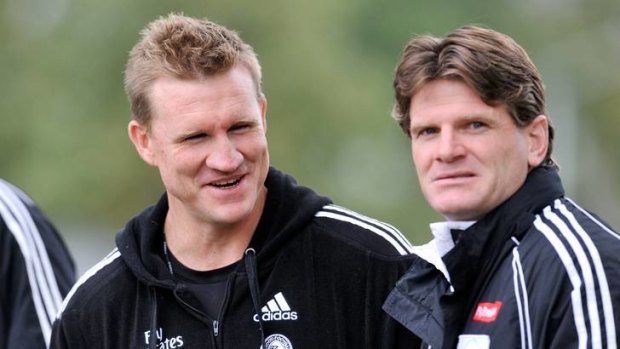 Hatching a plan: Collingwood's Nathan Buckley with Robert Harvey (right).