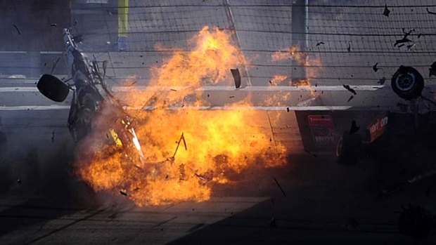 Dan Wheldon's car bursts into flames in a 15-car pile-up during the Las Vegas Indy 300.