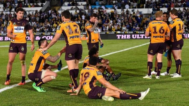 The Broncos gather together on the field after losing the NRL 1st Elimination Final match between the North Queensland Cowboys.