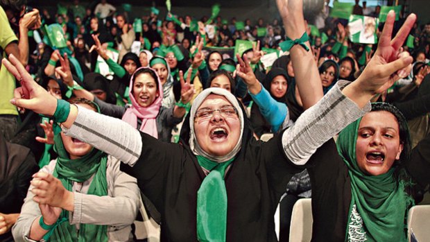 Going for green ... supporters of Iranian presidential candidate Mir-Hossein Mousavi at a campaign rally in Tehran.
