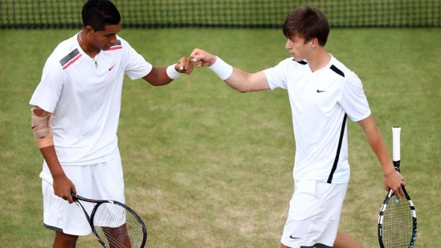 Nick Kyrgios and Andrew Harris have picked up their second consecutive grand slam title.