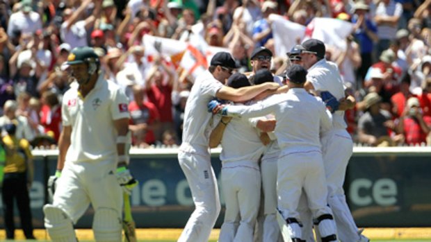 The moment ... English players react after capturing the final wicket of the match.