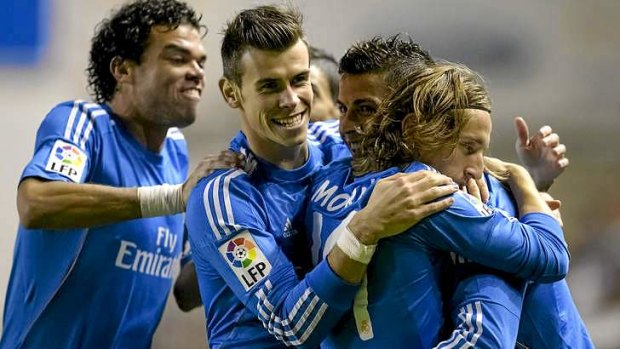 Cristiano Ronaldo celebrates with Luka Modric (R), Gareth Bale (2ndL) and Pepe.