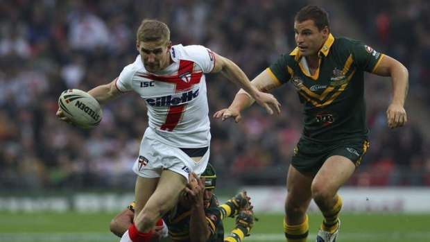 Excitement machine: Sam Tomkins proving a handful for Kangaroos defenders Johnathan Thurston and Anthony Watmough in 2011.