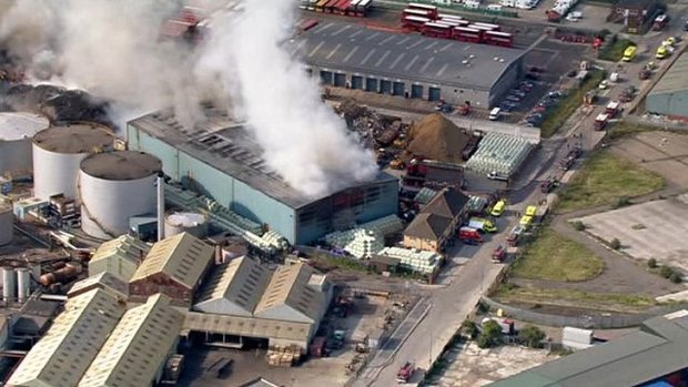 This television screen grab shows the fire in its early stages at a recycling centre in Dagenham, east London.