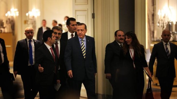 Centre of power: Recep Tayyip Erdogan (in striped tie) arrives at Istanbul's Shangri-La Hotel on May 29 to sign off on a natural gas project with Azerbaijan.