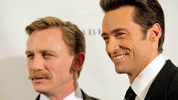 Charity strip-off ...  Daniel Craig and Hugh Jackman auctioned their singlets for Broadway Cares.