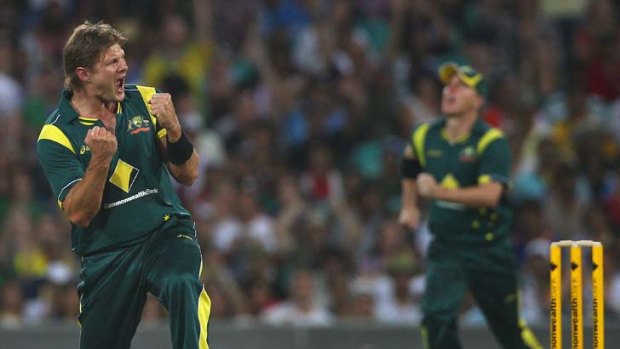 Shane Watson celebrates dismissing Virat Kohli on the way to an 87-run victory and a place in the finals.